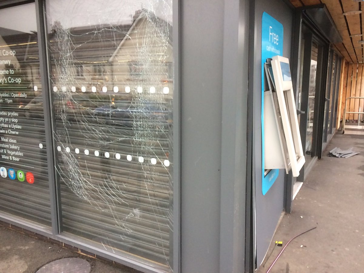 C_Dearden's tweet image. Police investigating after thieves entered Co-op Deganwy in the middle of the night and blew up the cash machine to steal money.  Considerable damage to machine and to store windows.