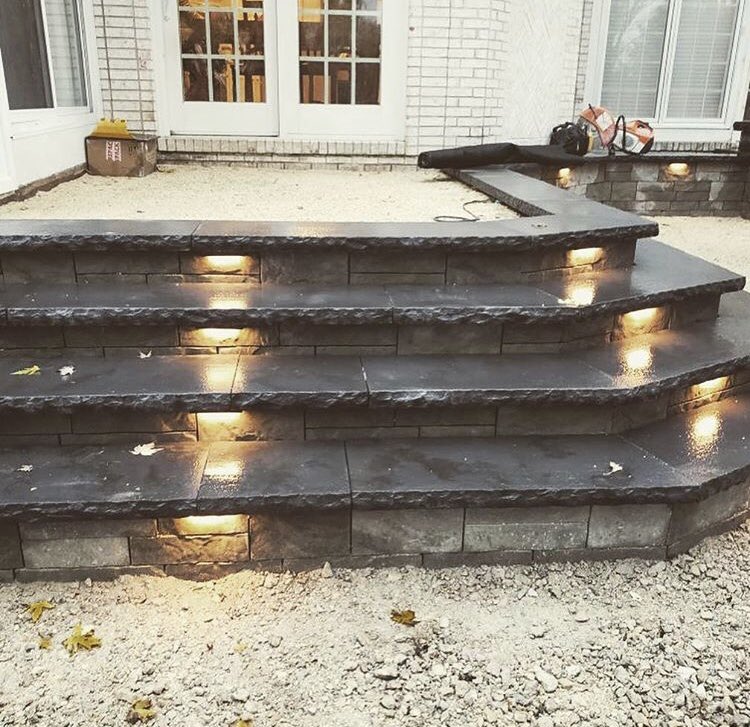 Testing out some hardscape lighting in this gloomy weather! #hardscape #landscapelighting #buildbetterbackyards