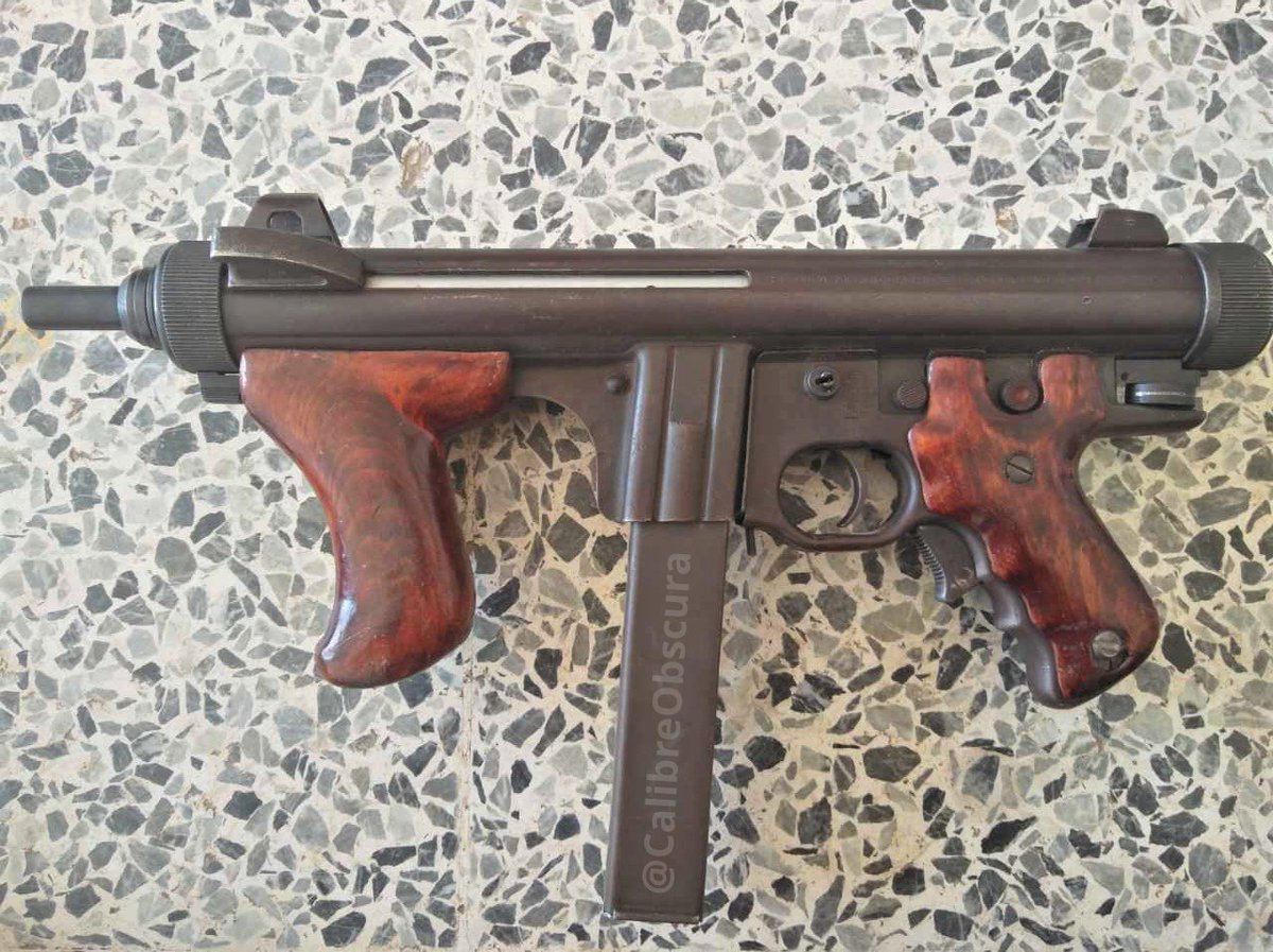 A Beretta M12 with some really good looking (Cherry Red?) furniture for sal...