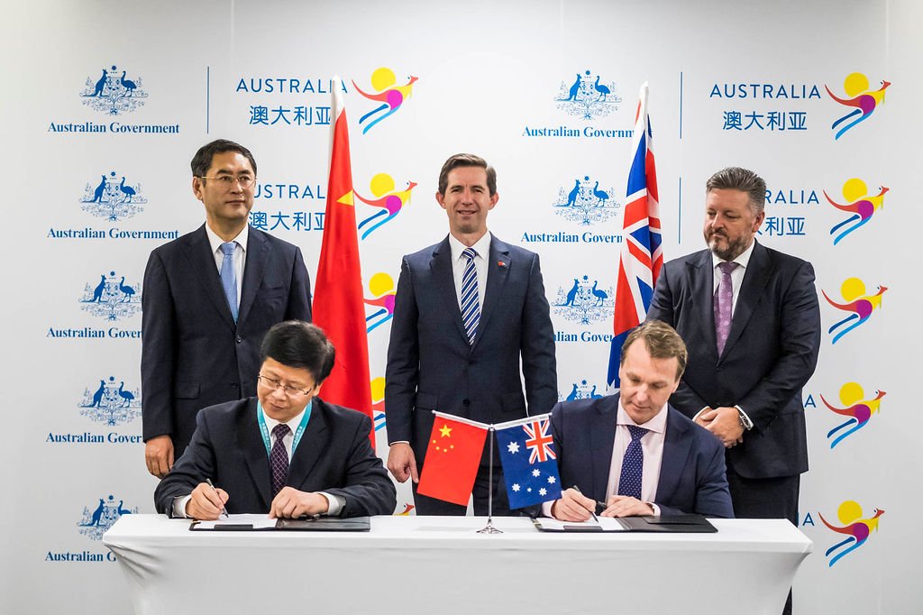 dfat's tweet photo. Trade Minister @Birmo witnesses deals worth nearly $15b during the signing of commercial MoUs at the China International Import Expo. Deepening Australia’s engagement with China, our largest trading partner. #CIIE18 https://t.co/9vBzRWwqVF https://t.co/kU3j5JezNp
