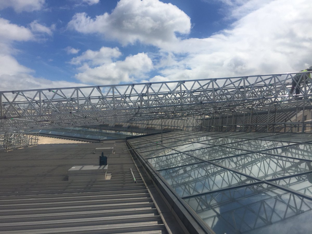 GodivaGroup1's tweet photo. Following on from yesterday’s post, this weeks #throwbackthursday shows our roof covers being built on the ground first for increased safety, and then crane lifted into position #roofcover #scaffolding #godiva #tbt #engineeringexcellence #aplatformforsuccess https://t.co/u2TQNTd3bi