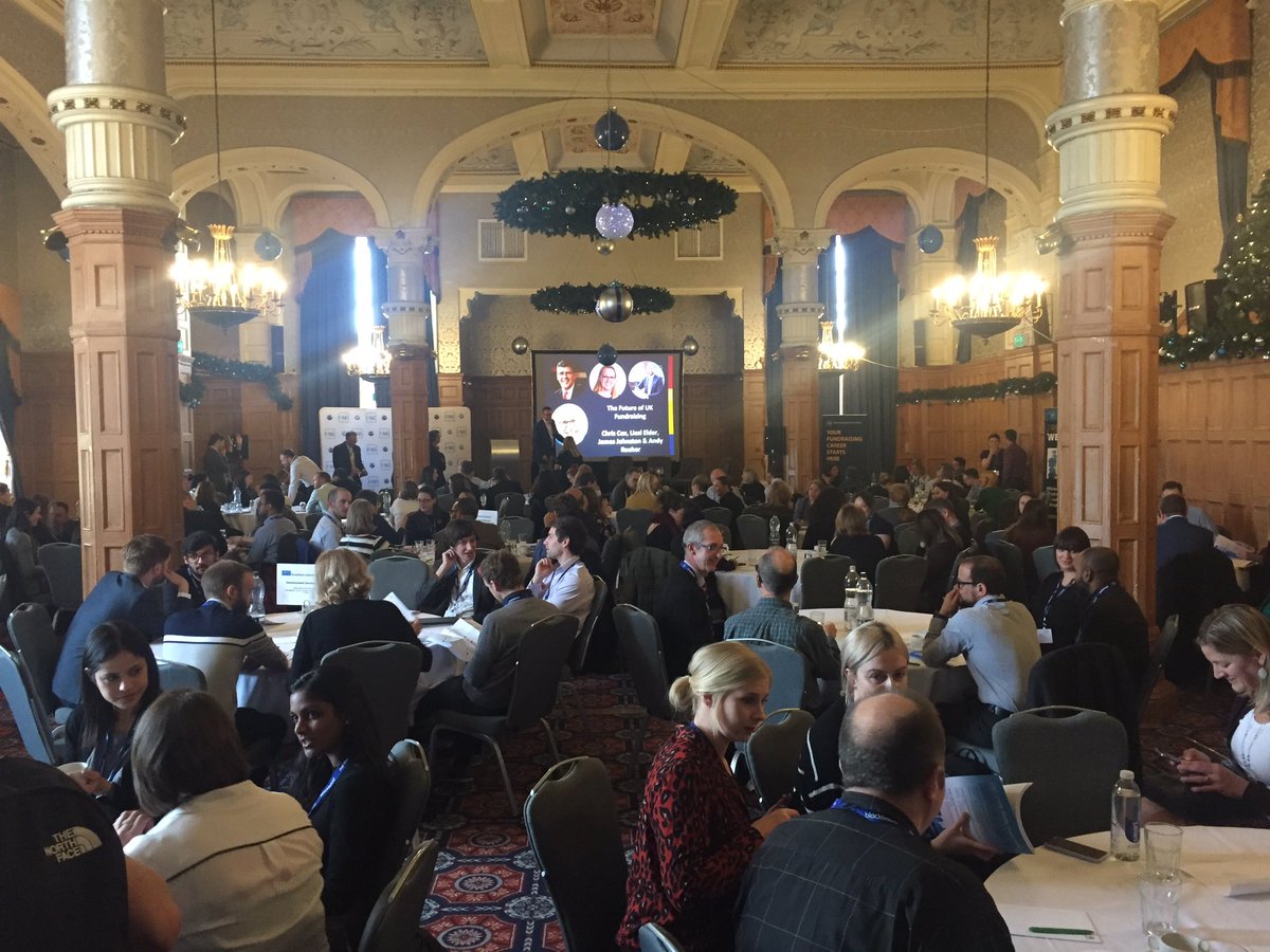 DDKeyworth's tweet photo. A full house for #devserv18’s Day 2 plenary, with several transformational leaders of our UK profession Liesl Elder, Chris Cox &amp; James Johnston, together with @blackbaud’s VP Data Intelligence Andy Reeher, exploring the future of fundraising, moderated by the amazing Jennie Moule https://t.co/5uKYJJHuzB