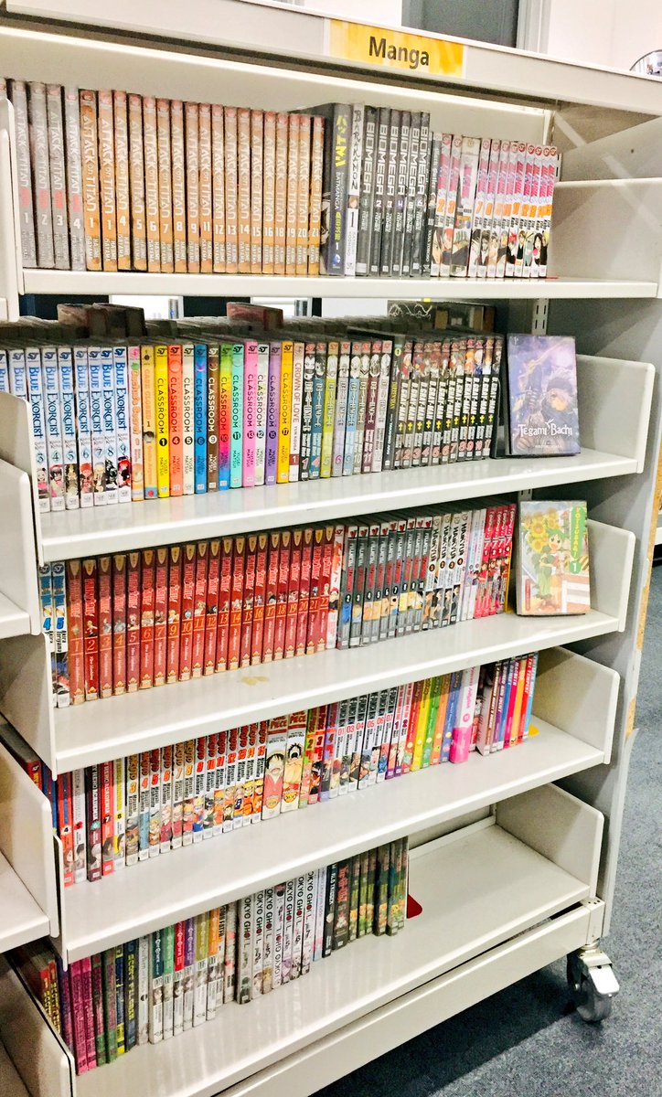 Sharing a #shelfie of our collection of #ComicsInLibraries! Buckets of manga, and a rapidly-growing stack of comics and graphic novels 📚⚠️💚