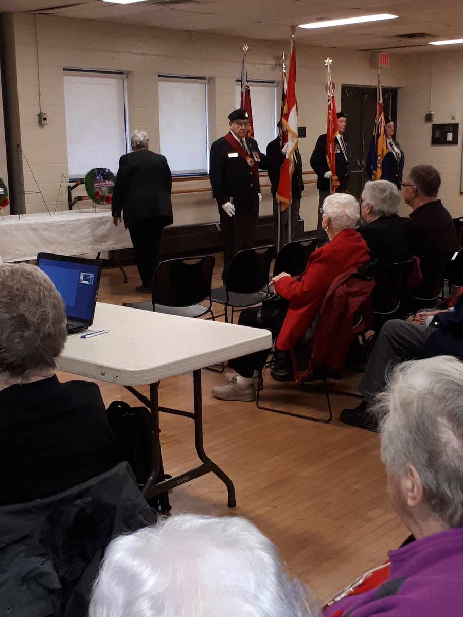 Kay Dubie lays a wreath on  behalf of Kanata seniors at Remembrance service  with Kanata Legion at Kanata Seniors Centre