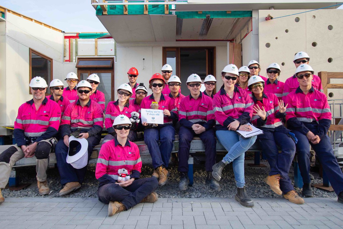 Team UOW sitting on the freshly built front deck of the #DesertRoseHouse on day nine of construction at the <a href="/SDMEDubai/">Solar Decathlon ME</a>