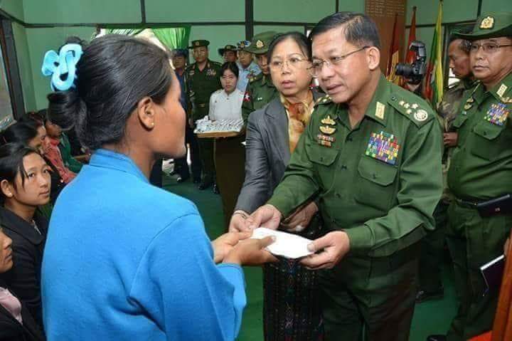 Commander SG Min Aung Hlaing pay helping money local ethnic people of Shan State, Myanmar.