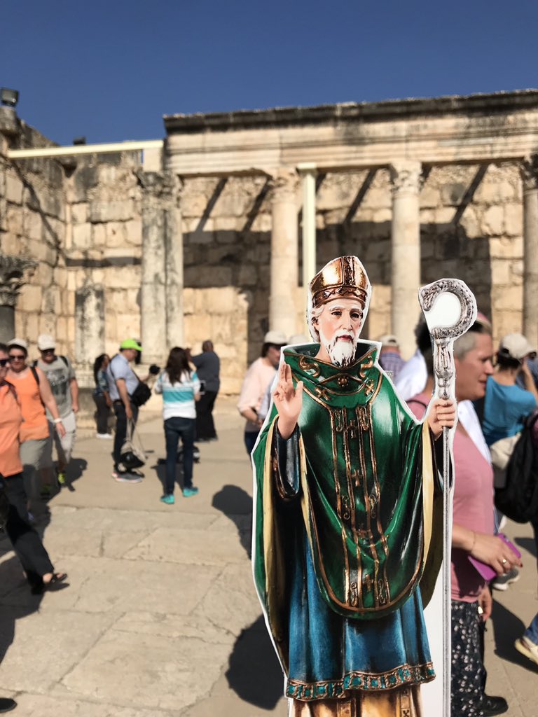 StPatSch's tweet photo. @PadreBrian and Flat St. Pat were busy tourists today!  They took a boat ride on the Sea if Galilee, visited the ancient city of Capernaum, Tabka the church of the multiplication of the loaves and fishes, and the home of Peter. #flatstpat  #stpatproud https://t.co/v5f3RUJFA6