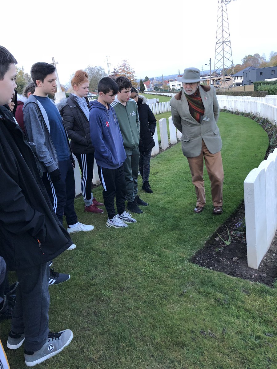 norton_pe's tweet photo. Year 9 paying their respects yesterday at their first stop of the trip at Longuenesse cemetery with our tour guide Alan Reed #battlefields2018 #armistice100 #Peteacherontour2018 https://t.co/1TXzz1gVXR