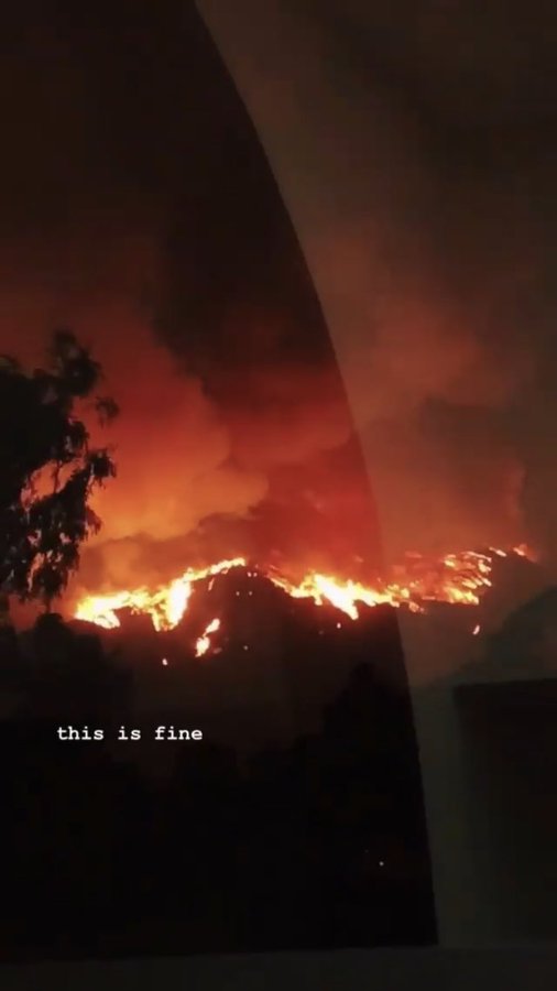 Intense red-orange fire & smoke w/ caption “this is fine”