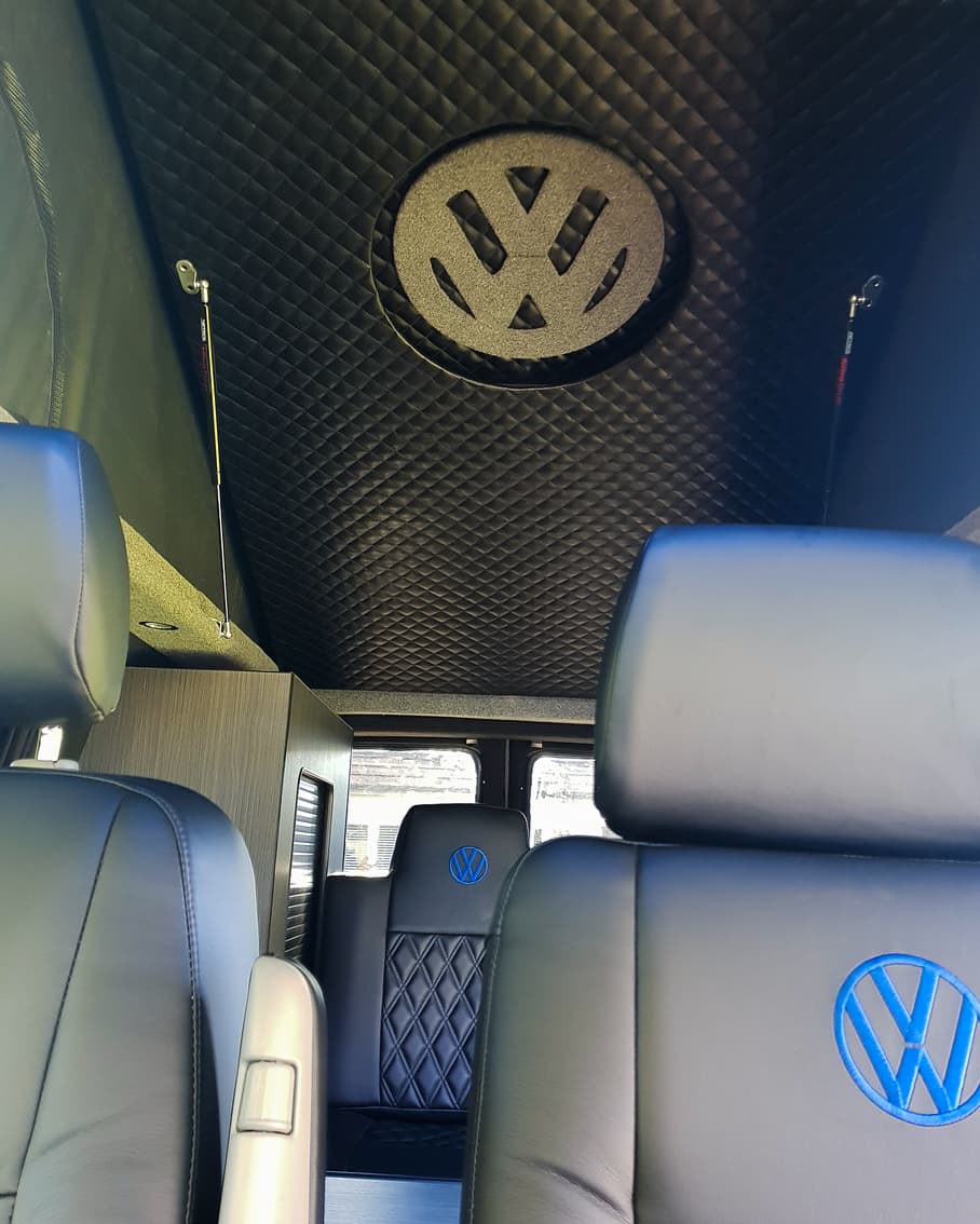 We absolutely love our new pop roof set up.  The underside of the bed has leatherette to compliment our comfy seats.  The VW logo also glows blue at night which we also love!  There's also room for a small mattress to be permanently stored in the roof too which we have included!