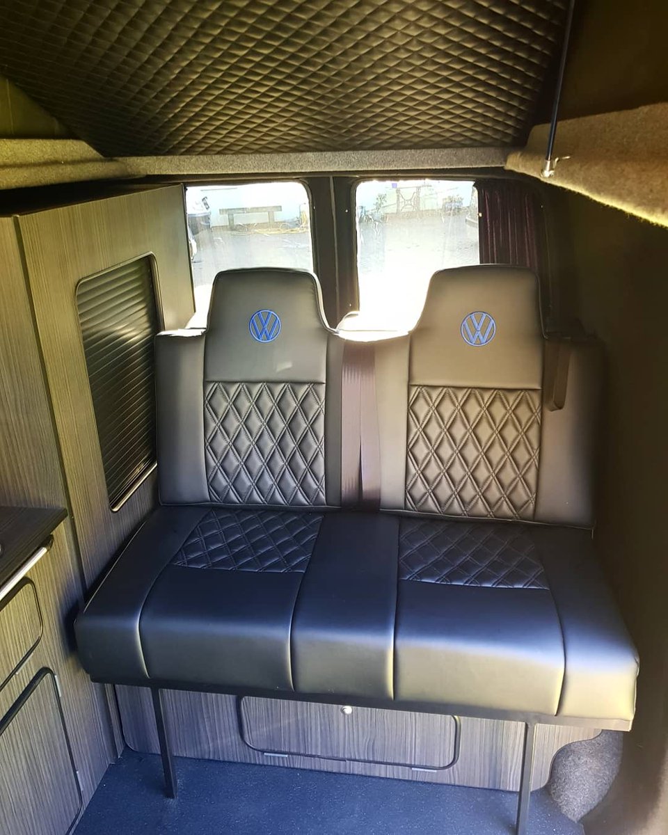 Rock n roll bed with blue logos to match the outside