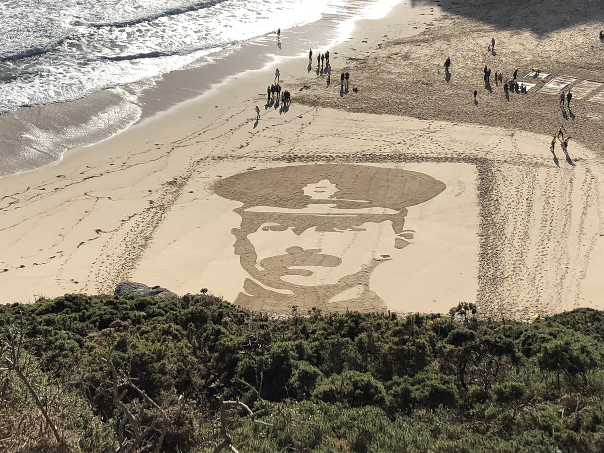 ChurchfieldJE's tweet photo. Just wow! Spectacular tribute in the sand at #Porthcurno #Cornwall to mark #Armistace100 #PagesOfTheSea #lestweforget https://t.co/C3klhLjZb3