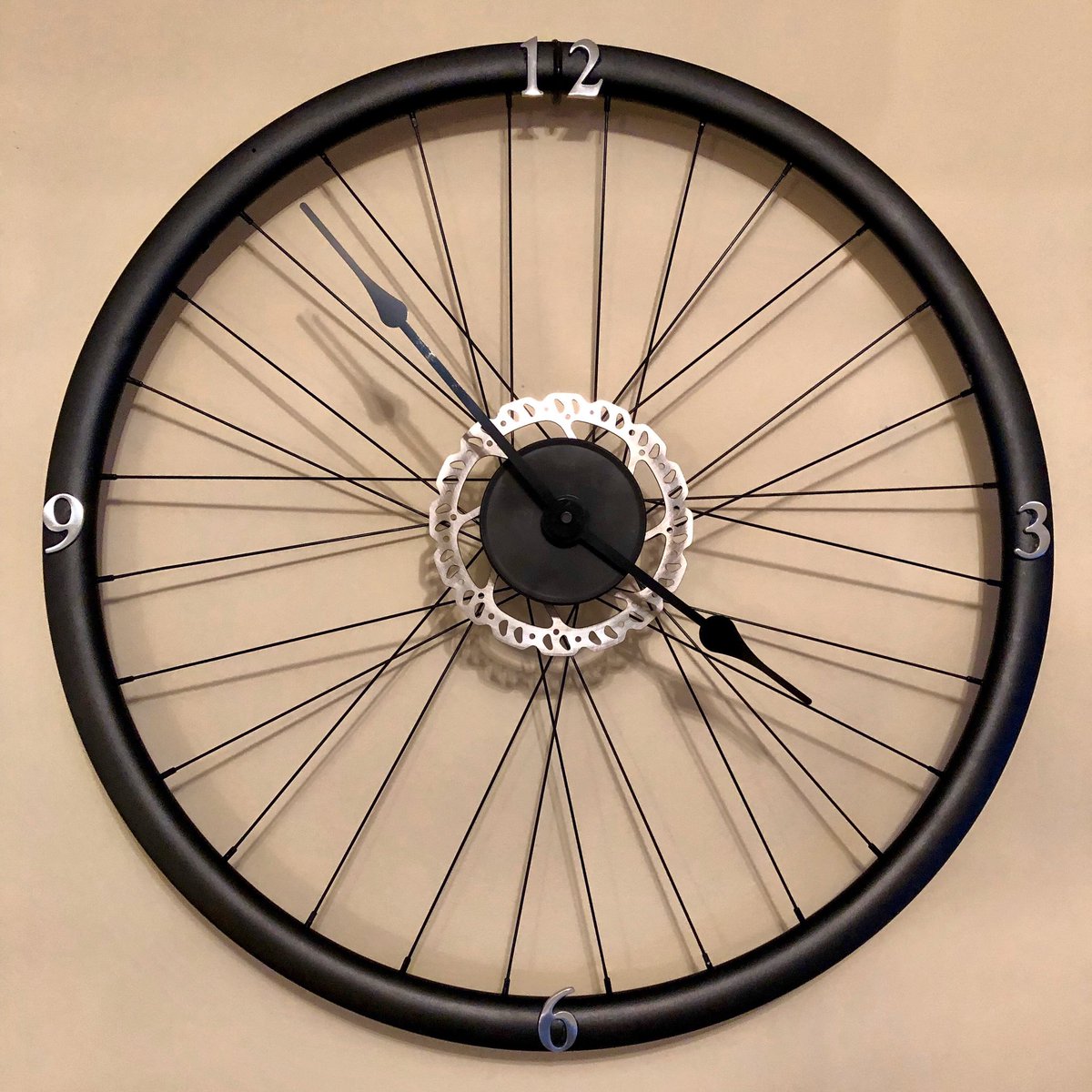 anghall6's tweet photo. So Iโve โup-cycledโ a bike wheel into a โbespokeโ clock! (can you see what I did there๐คช). Really pleased with it! ๐ด๐ปโโ๏ธ๐ #cycling #upcycled #bespoke #wheelclock https://t.co/u9wxYDRcVO