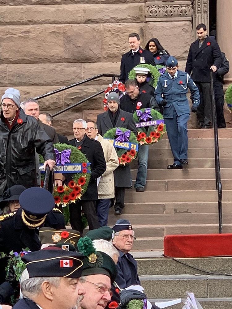 cupelocal79's tweet photo. Local 79 President @dmdmitchell laid a wreath at the Old City Hall #RememberanceDay ceremony this morning on behalf of @cupelocal79 members. We give our deepest gratitude to Canada’s veterans. We remember. #lestweforget https://t.co/QRvhOx1P2X