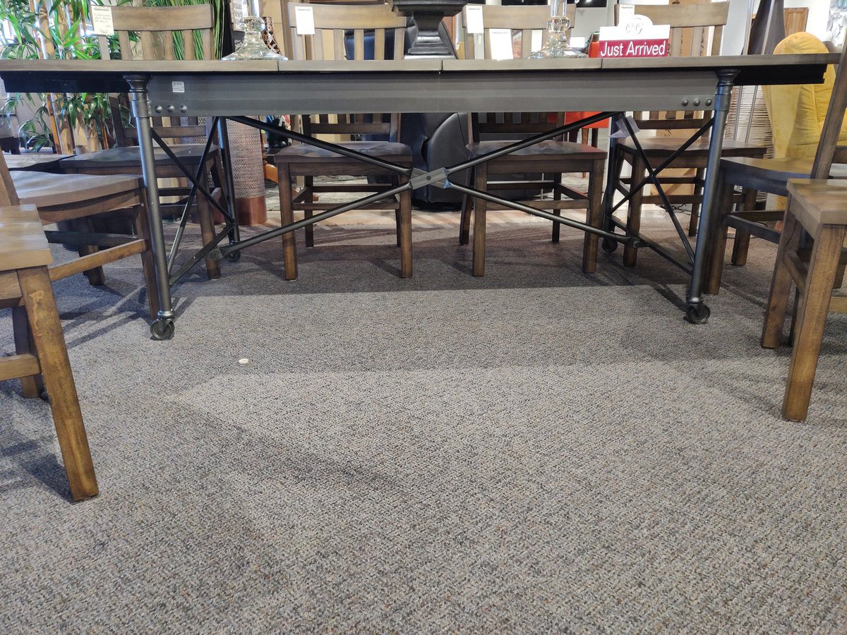 Rustic style with a modern twist! Love it!

35057-1893 Contemporary DR Table with Gunmetal Grey Base on Wheels/2 Leafs. Our price $995

35057-1895 Rubberwood Med. Brown DR Chairs. Our price $195