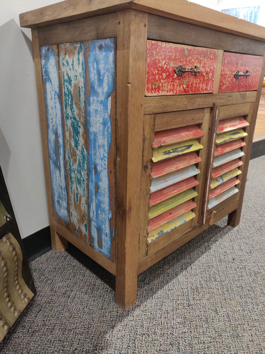 Reclaimed boat wood transformed into an incredible colorful sideboard!

14715-4 Reclaimed Boat Wood Sideboard NR. Our price $295

30028-3966 Kane Round Short Neck Ceramic Vase. Our price $25

30028-3965 Molly Round Short Neck Ceramic Vase. Our price $29