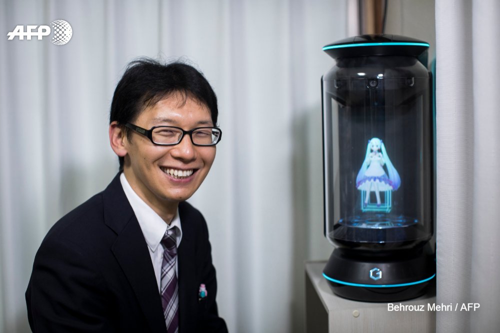AFP's tweet image. Crazy in love? The Japanese man &apos;married&apos; to a hologram.
Akihiko Kondo, a school administrator, married a virtual reality singer called Hatsune Miku in early November.  His mother refused to go to the wedding  
u.afp.com/oHkW