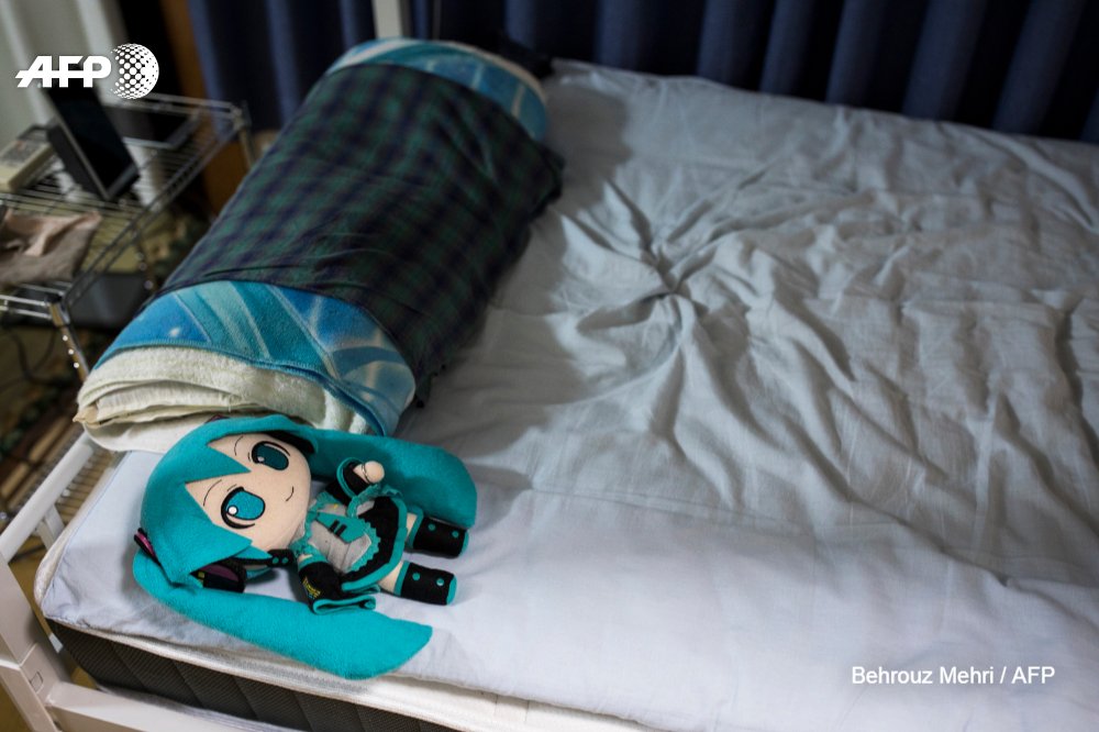 AFP's tweet image. Crazy in love? The Japanese man &apos;married&apos; to a hologram.
Akihiko Kondo, a school administrator, married a virtual reality singer called Hatsune Miku in early November.  His mother refused to go to the wedding  
u.afp.com/oHkW