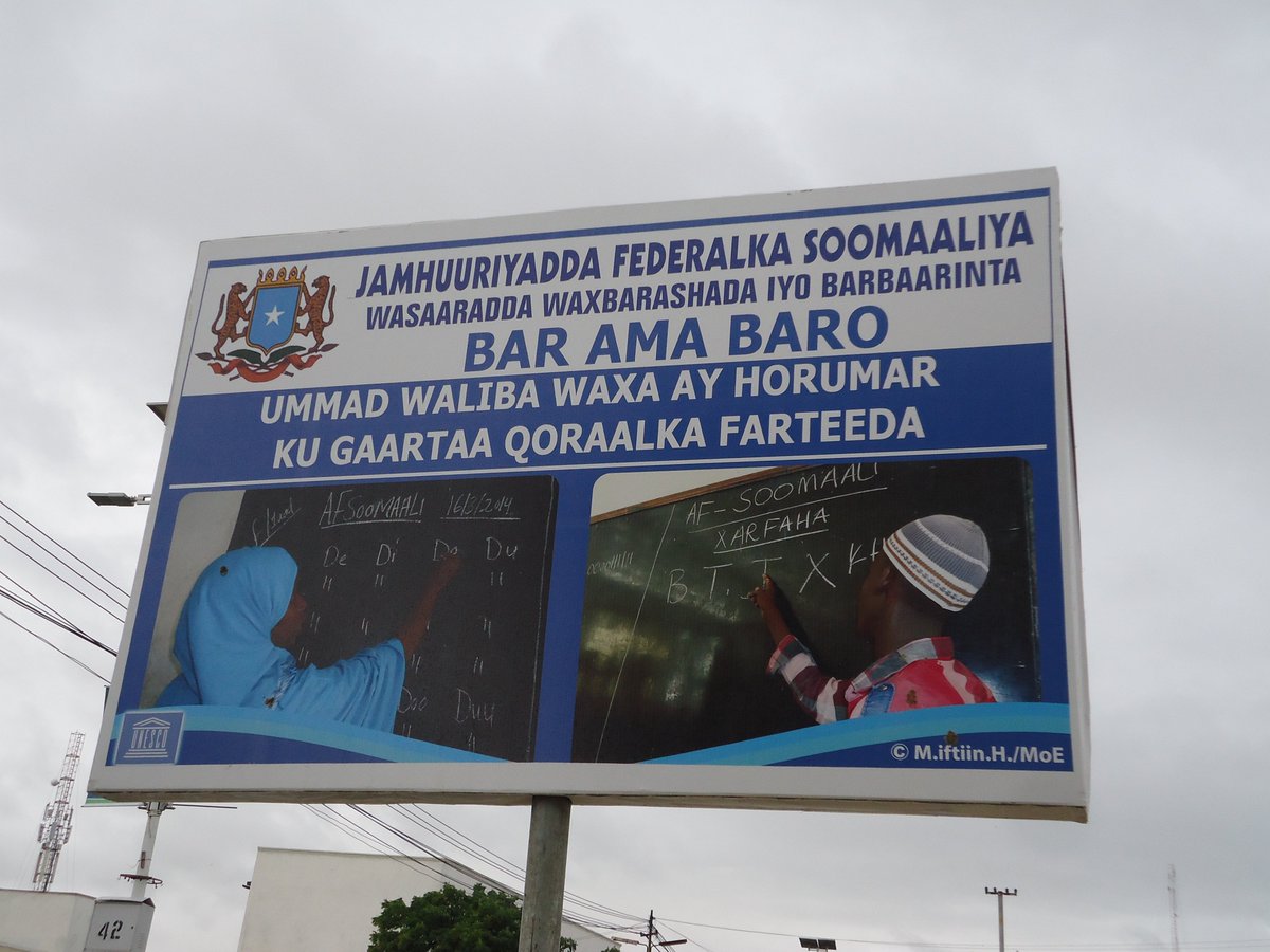 MoulidHujale's tweet photo. In 2013, I had the privilege of working w/@DrMaryanQasim on the #Go2School campaign whch pioneered the revival of the 1st public primary education in #Somalia after more than 2 decades. Photographed these brave teachers on the billboard, their COURAGE inspired me & kept me going. https://t.co/dz4uiKj2YG