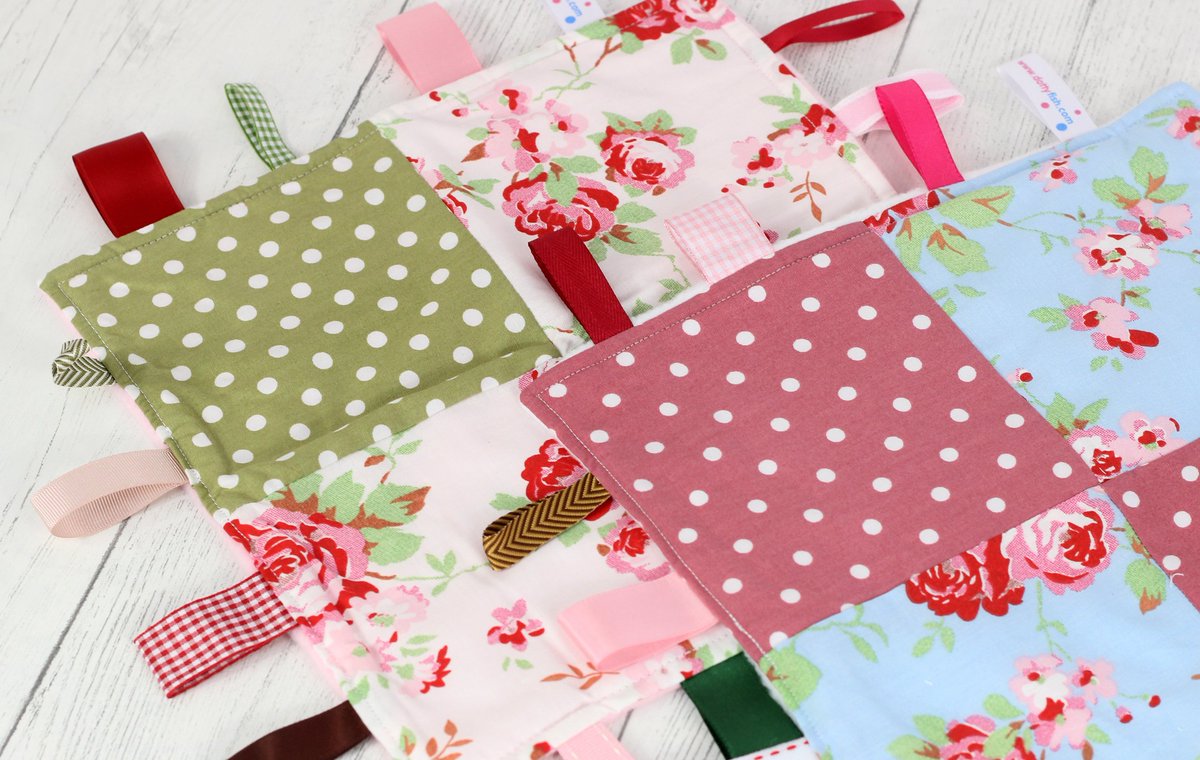 dottyfishltd's tweet photo. Have you seen our Cath Kidston tag blankets? We have 2 designs available, each as snuggly as the other and lovingly handmade here in the UK. The ribbon tags around the outside are perfect for developing fine motor skills https://t.co/2fOMoV6EQk #Cathkidston #Tagblanket #Dottyfish https://t.co/uH6hKSBvvt
