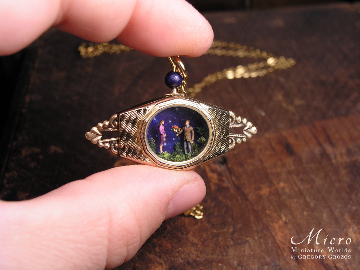 GregoryGrozos's tweet photo. Hello  everyone! Here is one of my latest unique designs. A romantic scene of a  tiny man offering a tiny woman a bouquet of flowers. It has been built  in a small wristwatch case and is to be worn as a pendant. Enjoy!
 You can find this at my Etsy shop:
 https://t.co/GFkhFUY4ho https://t.co/sv9BTwwwel