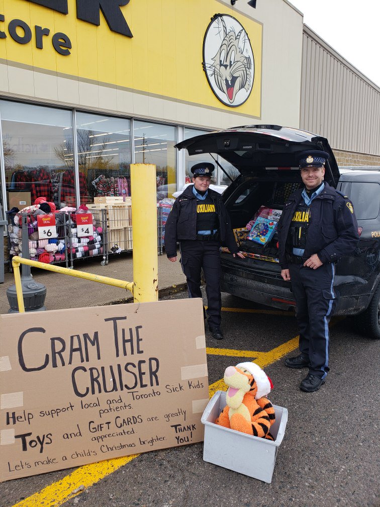 OPP_CR's tweet photo. #Auxiliary members Mike & Megan working together with Giant Tiger in #Campbellford Stuffing the cruisers with toys and gift cards to support the #Nthld OPP toy drive. A big thank you to all who donated to make this event such a huge success.^kj https://t.co/i508Pev9JX