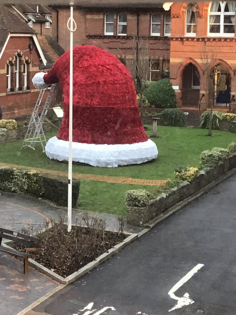 Giant hat has gradually been built opposite us  today. They turned off the lights just as I took the photo.