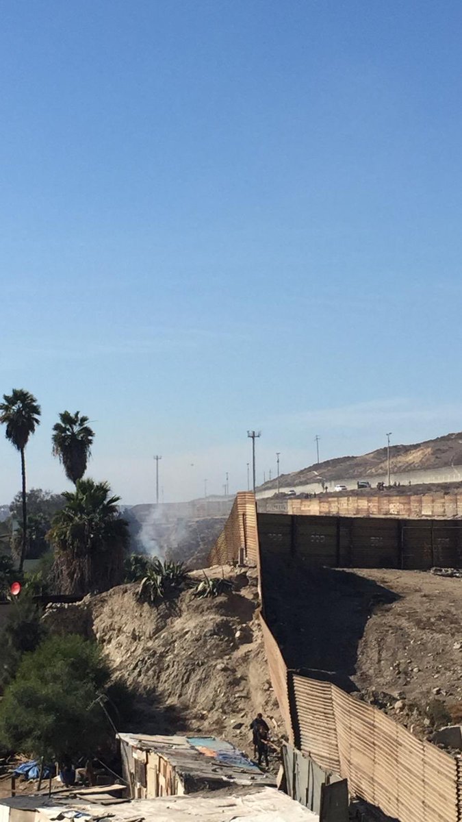 CosechaMovement's tweet photo. BREAKING: the San Ysidro border between US/Mexico has been shut down as reports are coming in that tear gas has been deployed on children. #Migrant Exodus https://t.co/7tezuEjfZ4