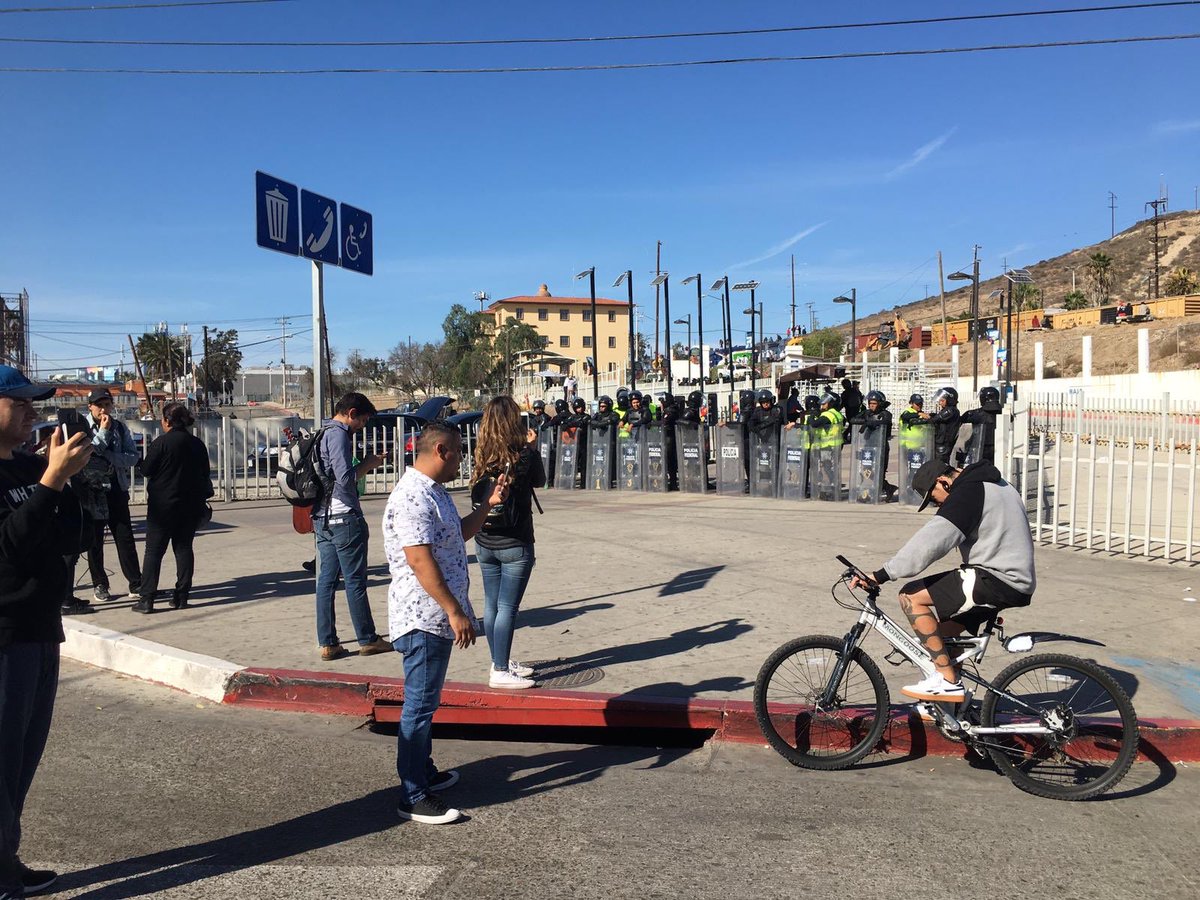 CosechaMovement's tweet photo. BREAKING: the San Ysidro border between US/Mexico has been shut down as reports are coming in that tear gas has been deployed on children. #Migrant Exodus https://t.co/7tezuEjfZ4