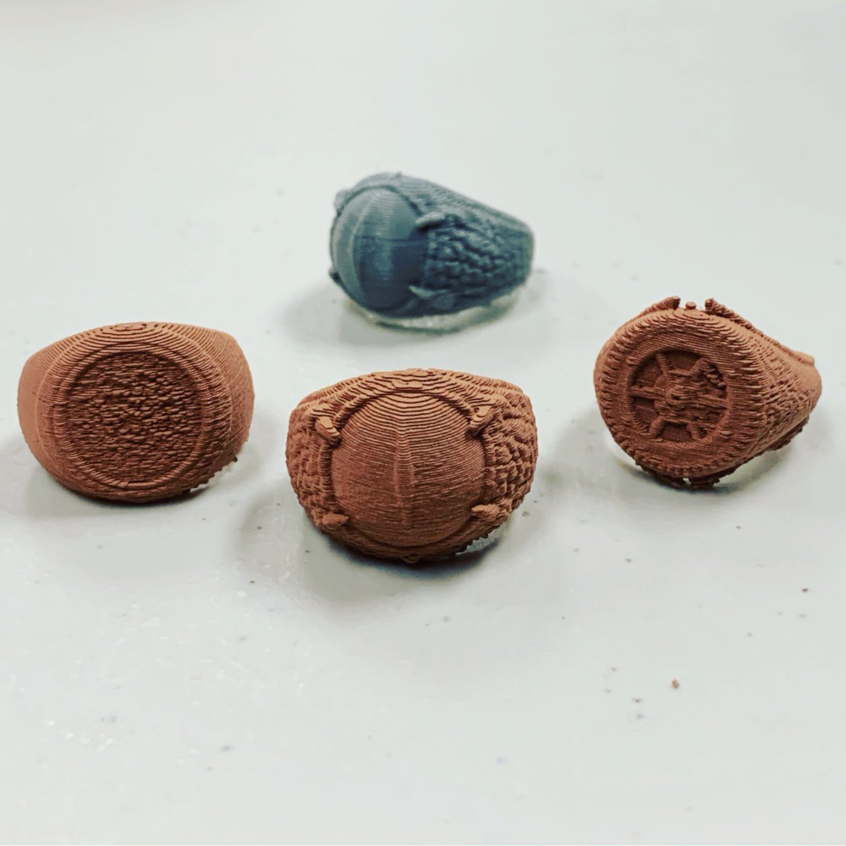 MakerWiz's tweet photo. Here are some gorgeous rings designed by @fotis.mint, made by @lulzbot3d #mini2 in @colorfabb_official #copperfill 100% infill. Check back tomorrow to see what tumbling does to them! #3dprinting #3dprinted #jewellery #jewelry #phaistos #dragon #steampunk #rings #makersgonnamake https://t.co/PBgeeCQ5MQ