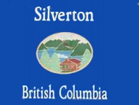 129: SILVERTON (1.5 points)- Looks like a VHS tape or cover a children's book- Those things are not flags- The logo could be for anywhere in B.C.