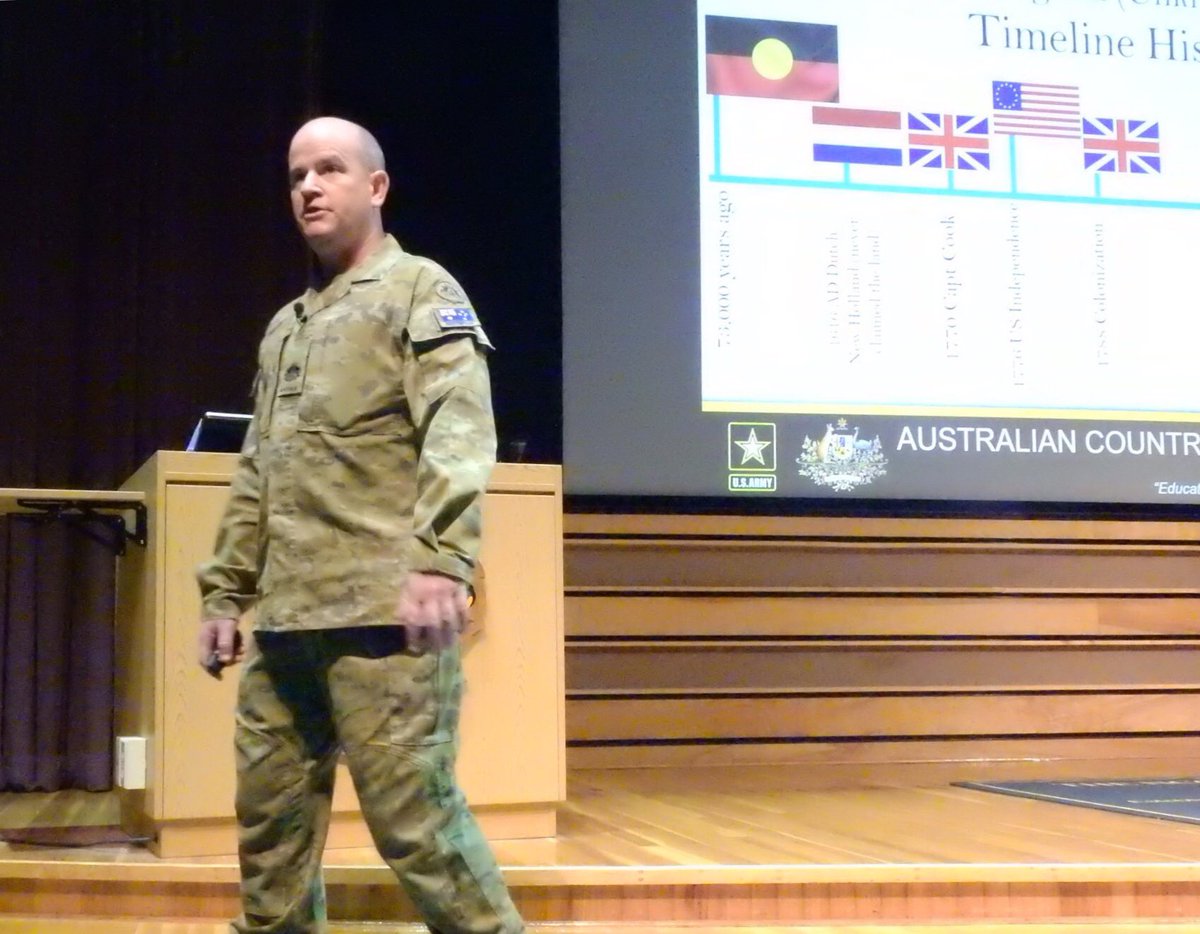 WO1_USASMA's tweet photo. WO1 Andrew Killen had the honor &amp; privilege of delivering his country brief to the cadre and students of SMC Class 69. Whilst learning about the history of Australia, the students were given the opportunity to taste a vegemite scroll. Thanks to Pru for baking over 700. #AusArmy https://t.co/QWtzMd0Bab