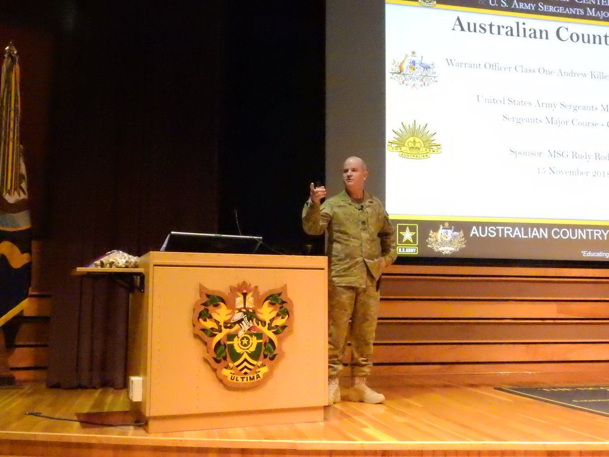WO1_USASMA's tweet photo. WO1 Andrew Killen had the honor &amp; privilege of delivering his country brief to the cadre and students of SMC Class 69. Whilst learning about the history of Australia, the students were given the opportunity to taste a vegemite scroll. Thanks to Pru for baking over 700. #AusArmy https://t.co/QWtzMd0Bab