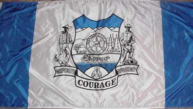 104: WILLIAMS LAKE (3.57 points) - COURAGE - You can barely read the "hospitality" and "opportunity" because it's so squished in, just like everything in this flag- This could have been good with like 65% of the elements removed