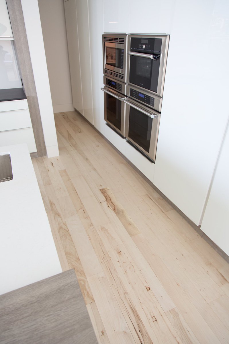 HWDCo's tweet image. Who likes modern white kitchens??? Our bleached pecan floors look stunning in this modern home in Austin, Texas. Southern Pecan wood is the perfect wood species to bleach light and give you that modern look.