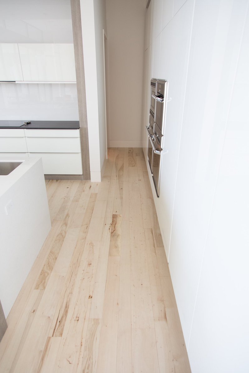 HWDCo's tweet image. Who likes modern white kitchens??? Our bleached pecan floors look stunning in this modern home in Austin, Texas. Southern Pecan wood is the perfect wood species to bleach light and give you that modern look.