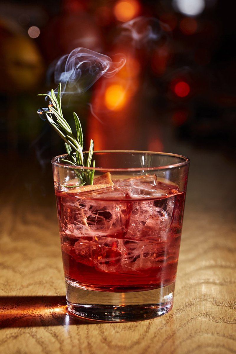This Negroni riff from @hellostrangebar matches mezcal’s earthiness with the herbaceous aroma of rosemary. bit.ly/2RWioJk