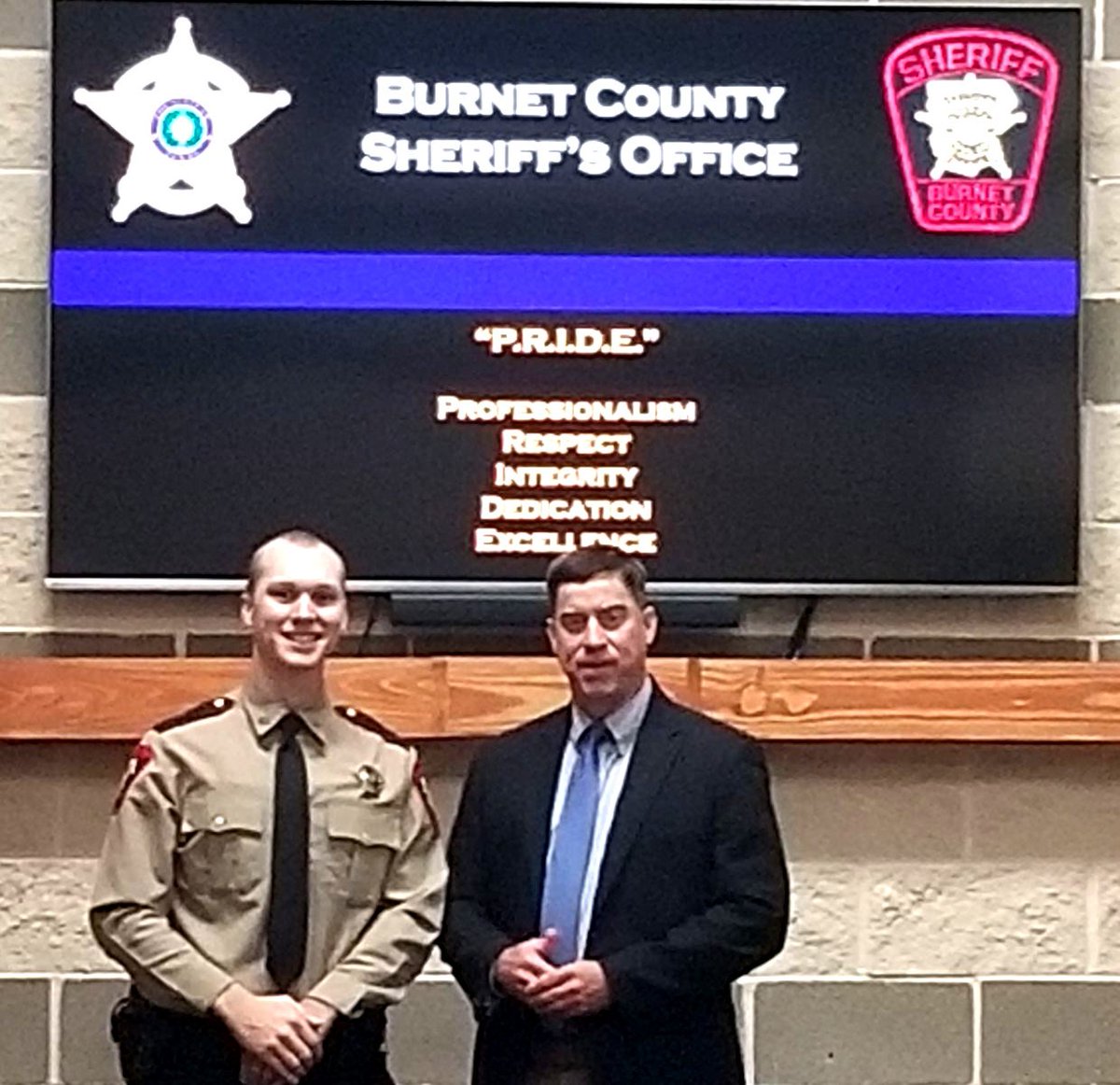 BurnetSheriff's tweet photo. BCSO is proud to announce Deputy Kyle Schulze as the newest member of our BCSO family. He was sworn in today by Sheriff Calvin Boyd.  Deputy Schulze's father was present to pin on his badge.  Welcome aboard, Kyle! https://t.co/CetHKoJpAi