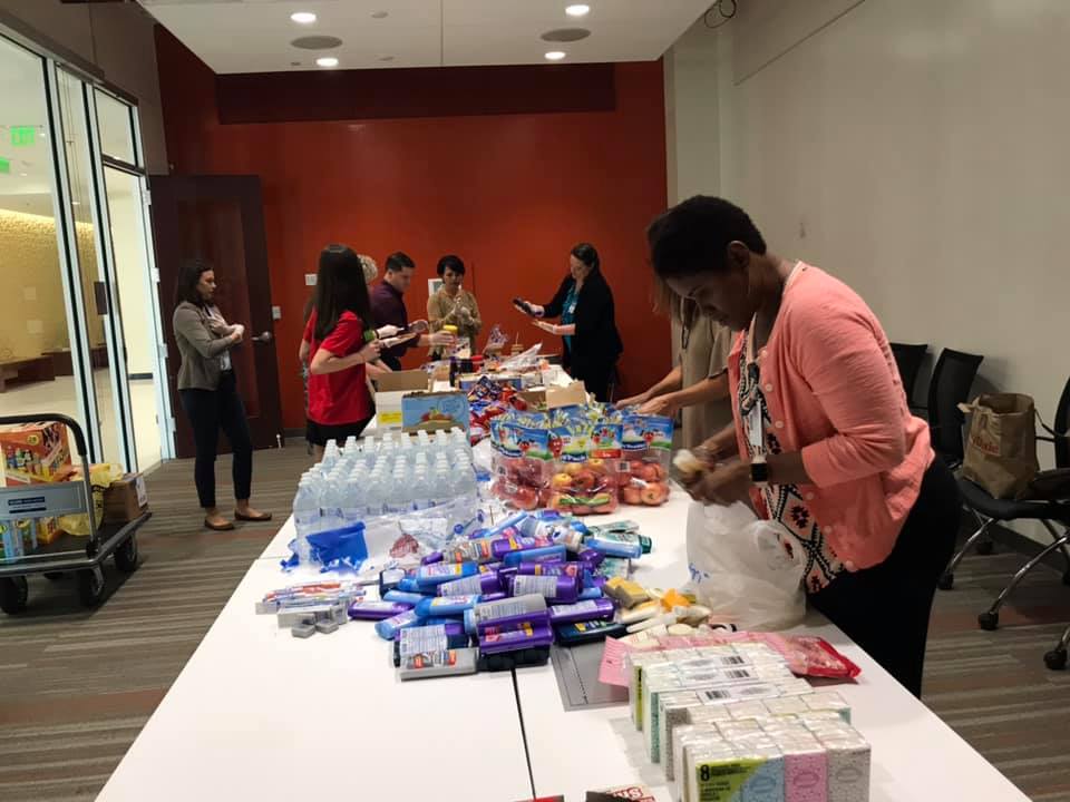 FirstCoastYMCA's tweet photo. A group of First Coast YMCA employees got together this week at our Metro office downtown to make and deliver almost 100 lunch bags for the homeless in 32202. #MyYZipCode #ForABetterUs https://t.co/2beMMzILCw