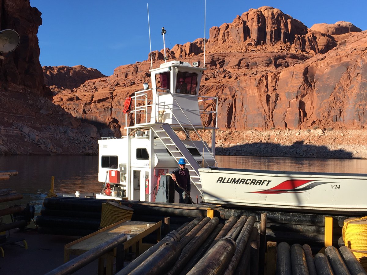 USGS_UT's tweet photo. On board with #USGS Utah Water Science Center and #DOSECC is operator of barge pusher. Shout out to that adorable supervisor outside the captain's tower! Thanks for getting the crew where they need to be and keeping them in water. #LakePowell #GlenCanyonDam #drilling https://t.co/7K5EMVTz8N