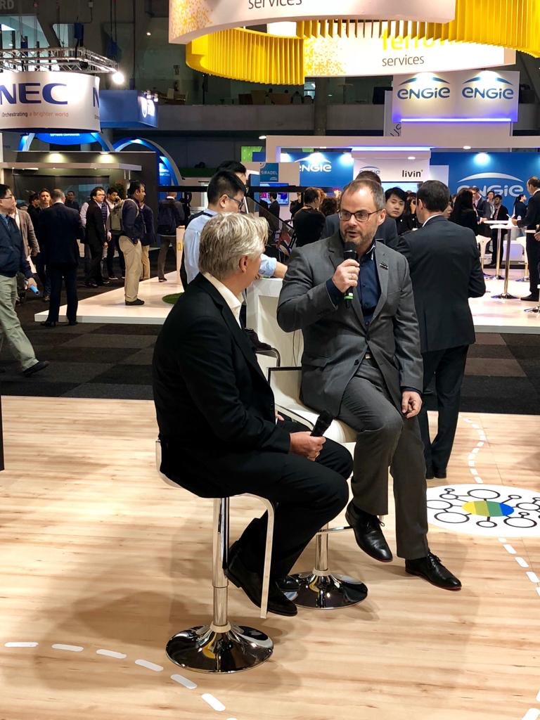GuntherDell's tweet photo. A cozy fireside chat. @HitachiVantara and @sap speak about how Video Intelligence and the SAP Cloud Platform can help create more livable cities. #SCEWC2018 #SSVI https://t.co/uuh4r06y9N