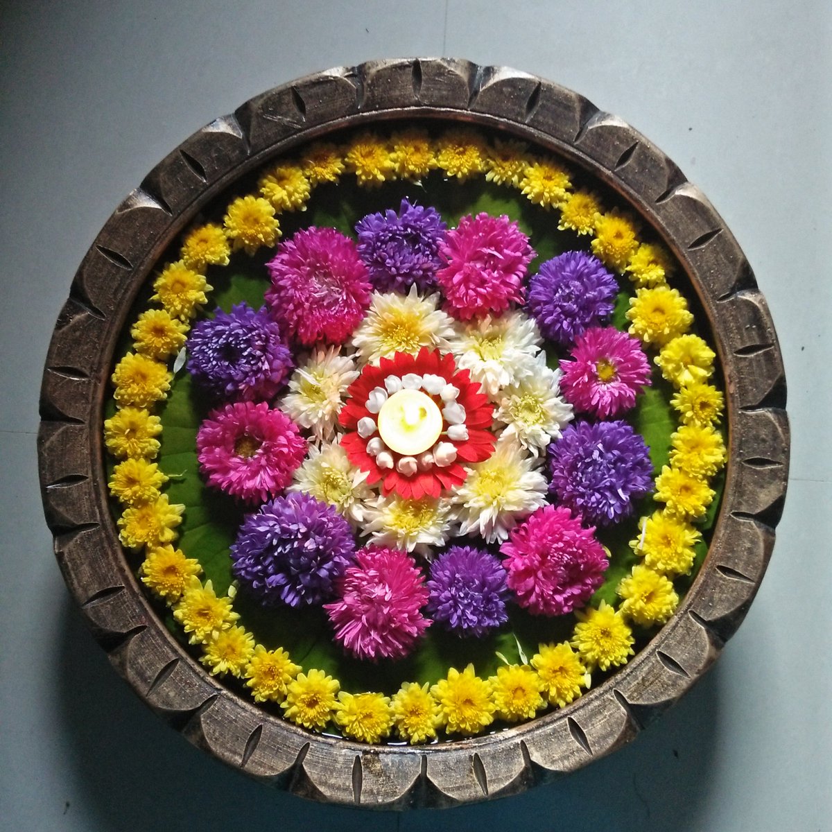 ତାପସ on Twitter: "That water container just adding to the beauty of your  floral Rangoli ?… "