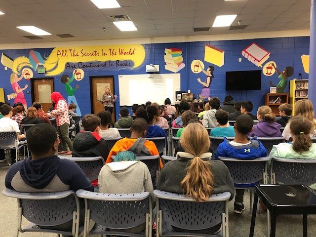 HaynesBridgeMC's tweet photo. 6th and 7th grade ELA students listen intently to Julane Fisher, author of Sour Lemon and Sweet Tea, as she talks to them about the importance of reading and writing and the process of writing her book. https://t.co/qkbyOfy75m