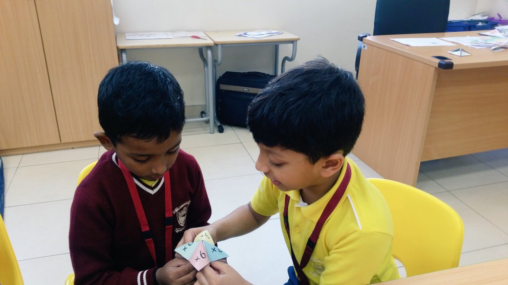 Gouri_Bhagwat's tweet photo. We didn't even realize mastering the multiplication facts playing with cootie catchers ~ #Cool2B #nmsprimary  #math @gemsnms_alkhail is so much fun~ @Fatima_Martin @ChristineDeNor1 @ShettySampoorna @Nahmiya15 https://t.co/1m1rFbPpXR
