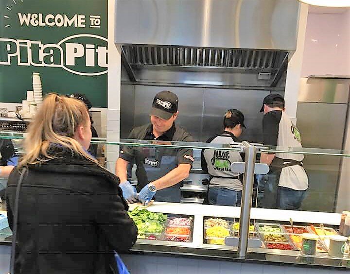 PitaPitIrl's tweet photo. Putting Pita Pit Co-Founder Nelson Lang to work on his visit to Dublin #pitapitireland #pointcampus #3arena #dublin https://t.co/F9ReLhLbvG