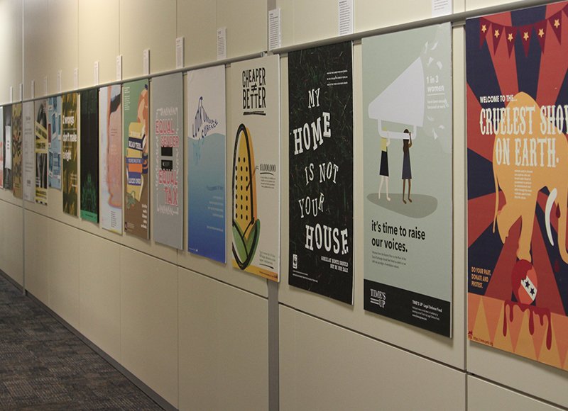 ArcD_KU's tweet photo. Impressive exhibit of #KUDesign student work on display now in Watson Library. Reception tonight at 5:00PM, 4th floor of Watson Library! @ArcD_KU @KUnews @kulibraries #design #advocacy #posters https://t.co/dyWnncusZU
