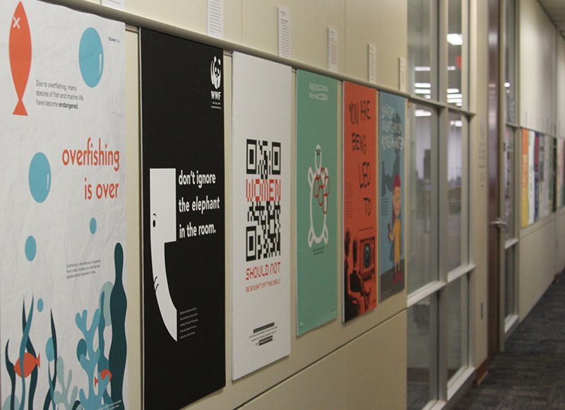 ArcD_KU's tweet photo. Impressive exhibit of #KUDesign student work on display now in Watson Library. Reception tonight at 5:00PM, 4th floor of Watson Library! @ArcD_KU @KUnews @kulibraries #design #advocacy #posters https://t.co/dyWnncusZU