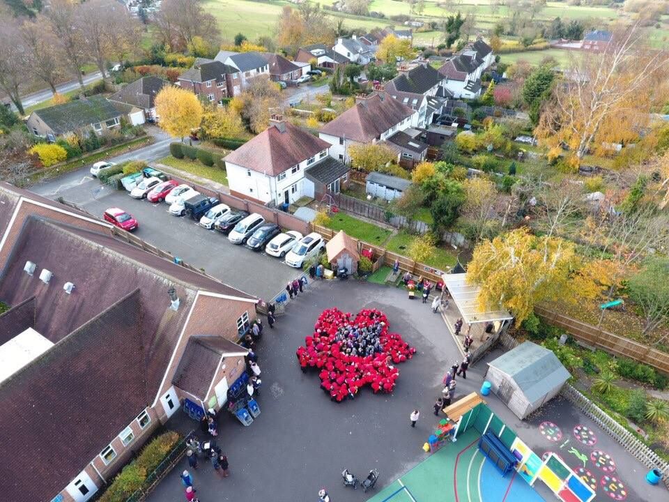 myheartcoop's tweet photo. A bird's eye view of Clifton-upon-Dunsmore C of E primary school remembering the fallen with their #humanpoppy Well done to everyone! https://t.co/7xdvGOgrrb