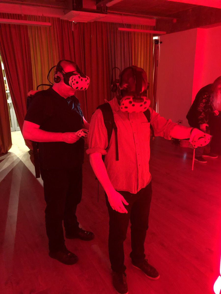 Kev_McLoughlin's tweet photo. Team night out in #VR at the @hyperreality12 pop-up in #shoreditch- lots of team building fun shooting zombies, solving puzzles and riding virtual roller coasters #AVtweeps https://t.co/QIjQ2I2dix