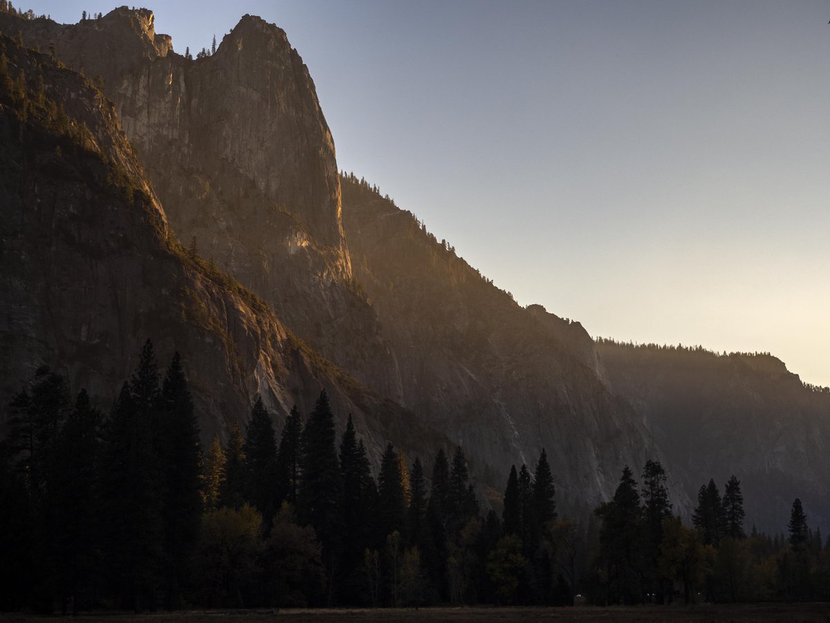 Sentinel Rock with an orange glow from low-angle sunlight